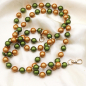 Preview: Handykette Olive-Orange – leuchtende 3D-Perlen, handgemacht